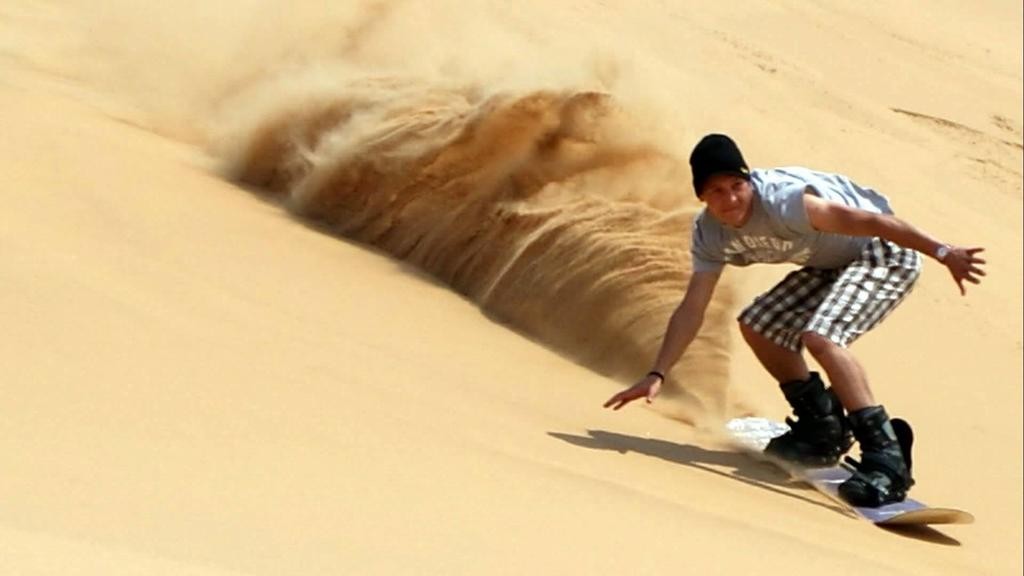 Sand boarding in the desert